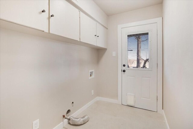 laundry room featuring baseboards, cabinet space, and hookup for a washing machine