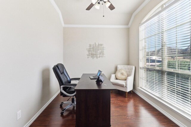 office space with baseboards, a ceiling fan, dark wood finished floors, and crown molding