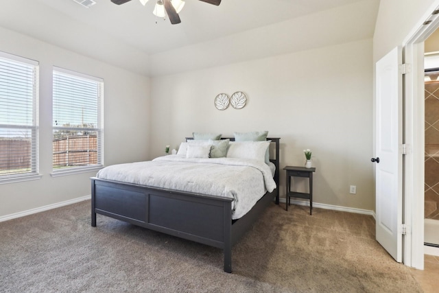 carpeted bedroom featuring visible vents, baseboards, and ceiling fan