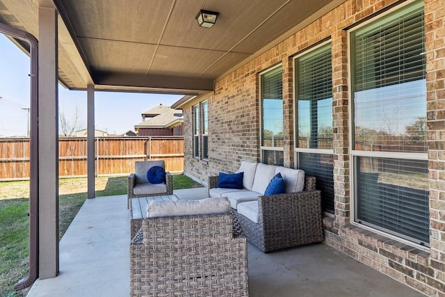 view of patio / terrace with an outdoor living space and fence