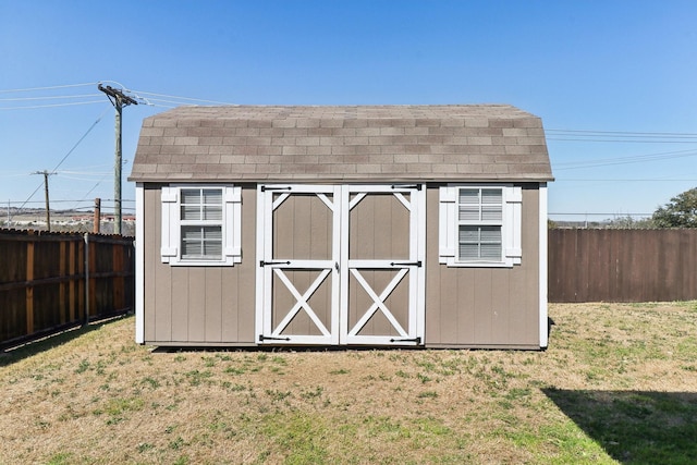 view of shed featuring a fenced backyard