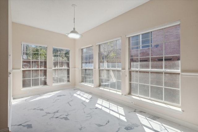 unfurnished sunroom with plenty of natural light