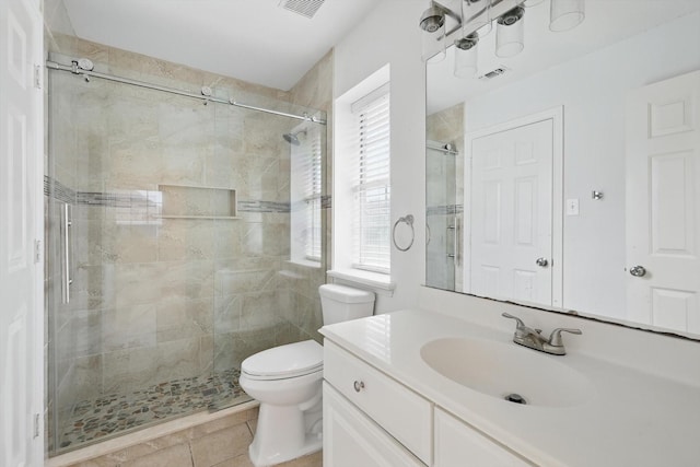 full bath with vanity, visible vents, a stall shower, tile patterned floors, and toilet