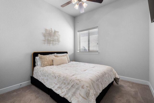 carpeted bedroom with baseboards and ceiling fan