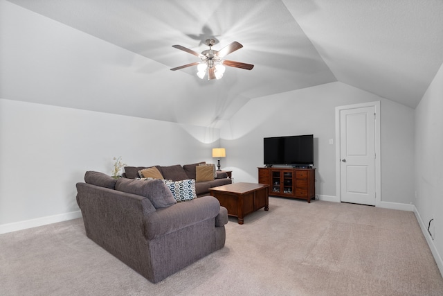 living area featuring light colored carpet, baseboards, and vaulted ceiling