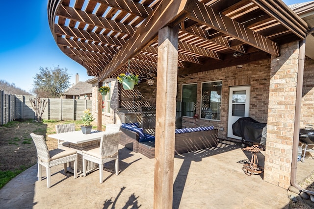 view of patio featuring a pergola, outdoor dining area, and a fenced backyard