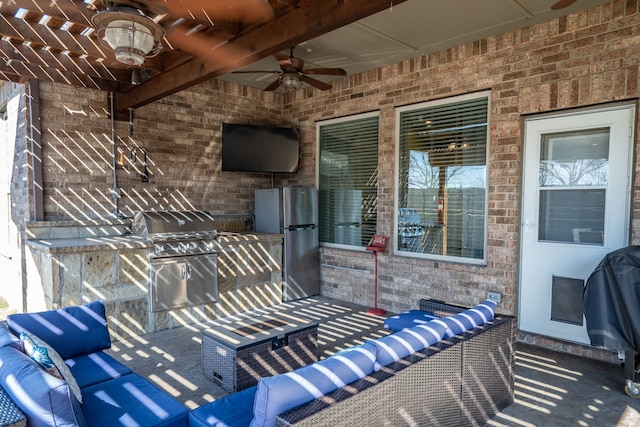 view of patio featuring grilling area and a ceiling fan