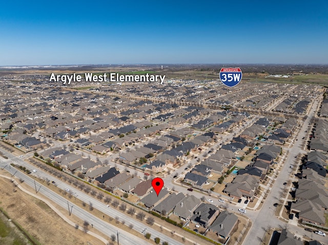 birds eye view of property with a residential view