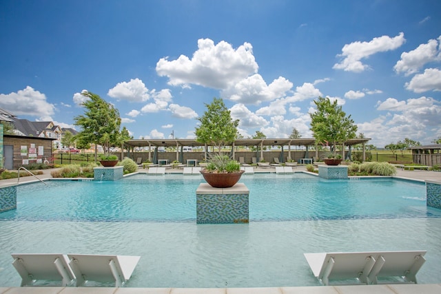 community pool featuring a patio area and fence