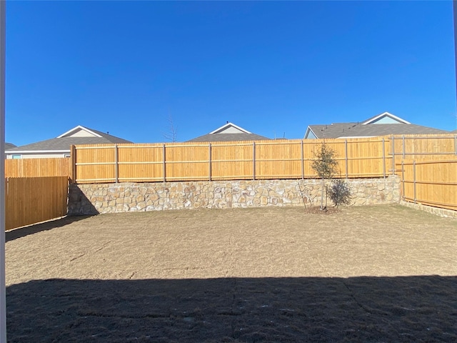 view of yard featuring a fenced backyard