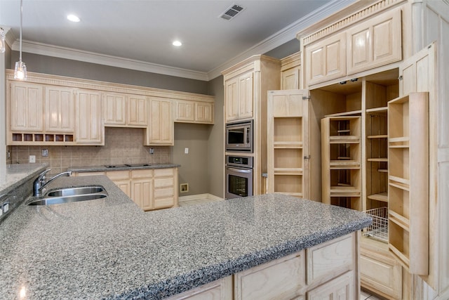 kitchen featuring tasteful backsplash, visible vents, ornamental molding, appliances with stainless steel finishes, and a sink