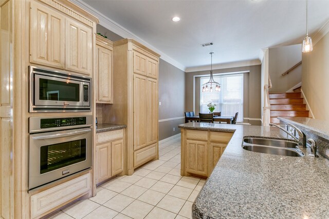 kitchen featuring ornamental molding, light brown cabinetry, a sink, appliances with stainless steel finishes, and light tile patterned flooring