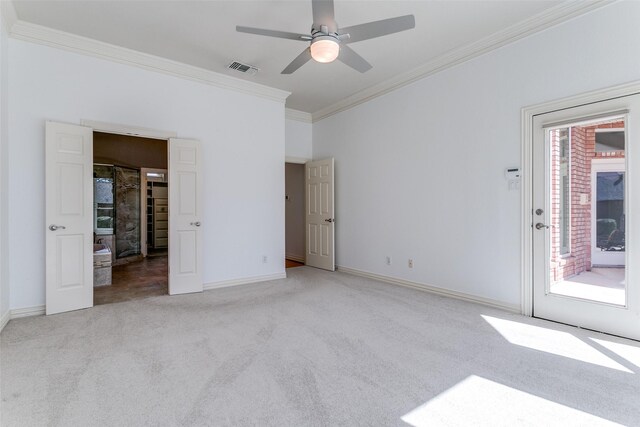 unfurnished bedroom featuring baseboards, visible vents, access to exterior, crown molding, and carpet flooring