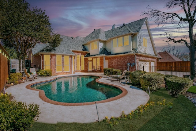 view of swimming pool with a fenced in pool, a fenced backyard, and a patio area