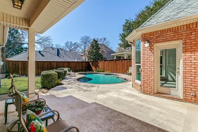 view of pool featuring a patio area, a fenced in pool, and a fenced backyard