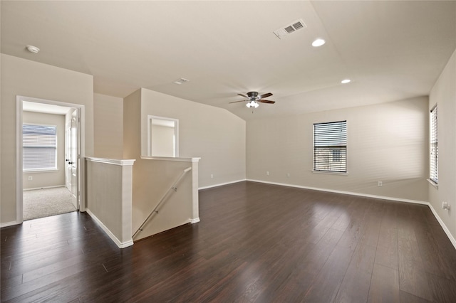 unfurnished room with recessed lighting, visible vents, a healthy amount of sunlight, and dark wood-style floors