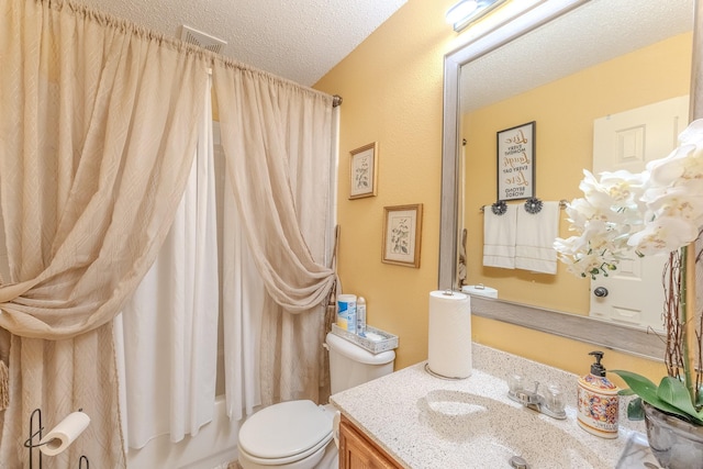 full bath with vanity, visible vents, shower / bath combo, a textured ceiling, and toilet