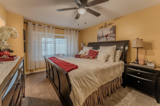 bedroom featuring a textured ceiling, a ceiling fan, and carpet floors