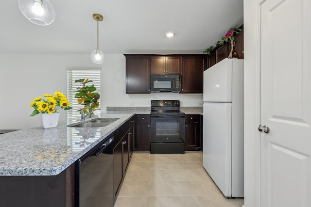 kitchen with dark brown cabinetry, light tile patterned floors, a peninsula, black appliances, and a sink