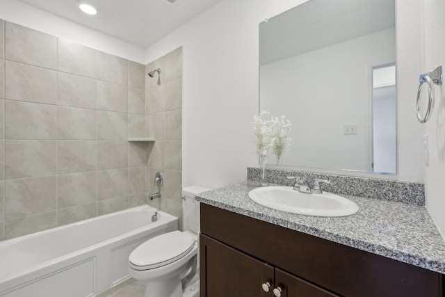 bathroom featuring shower / bath combination, toilet, and vanity