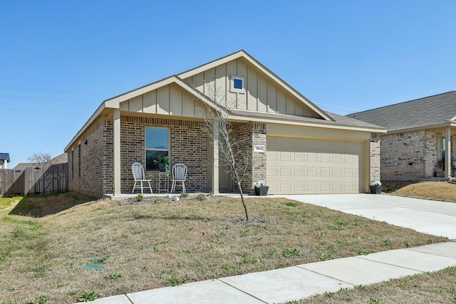 ranch-style home featuring a front yard, an attached garage, concrete driveway, board and batten siding, and brick siding