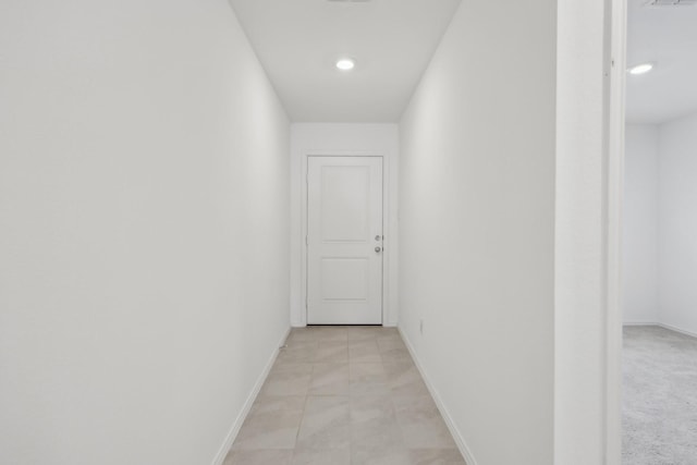 hallway featuring recessed lighting, visible vents, and baseboards