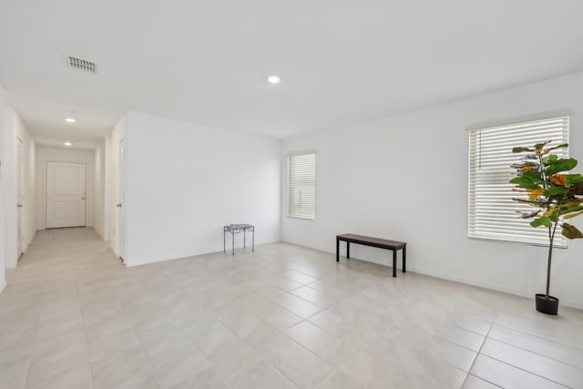 unfurnished room featuring light tile patterned floors, recessed lighting, and visible vents