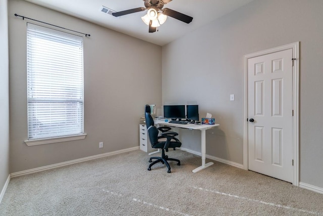 office space with baseboards, a ceiling fan, and carpet flooring