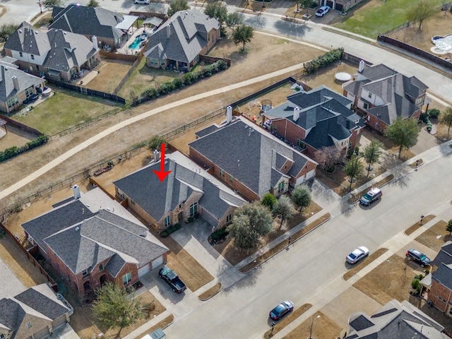 birds eye view of property with a residential view