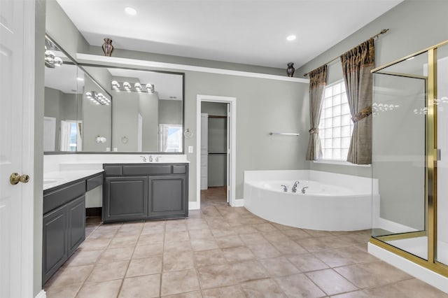 full bath with vanity, recessed lighting, a shower stall, tile patterned floors, and a bath