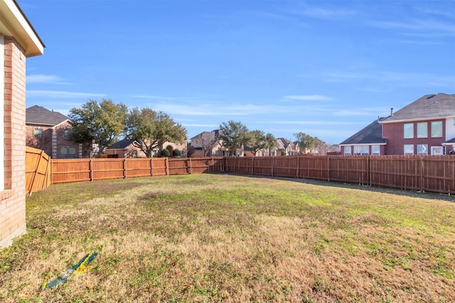 view of yard with a fenced backyard