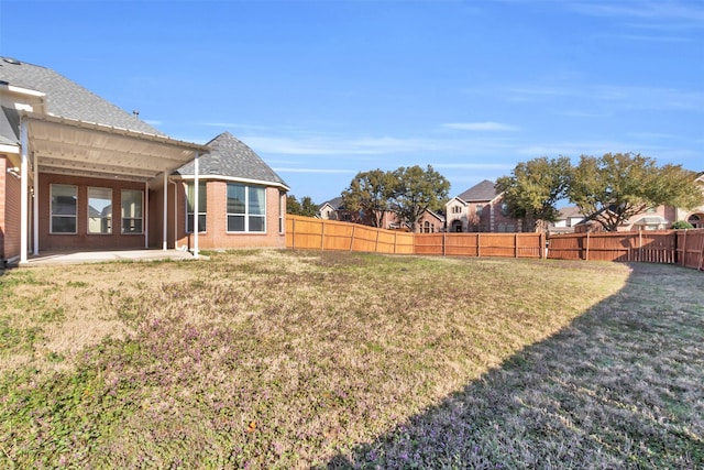 view of yard featuring a patio and a fenced backyard