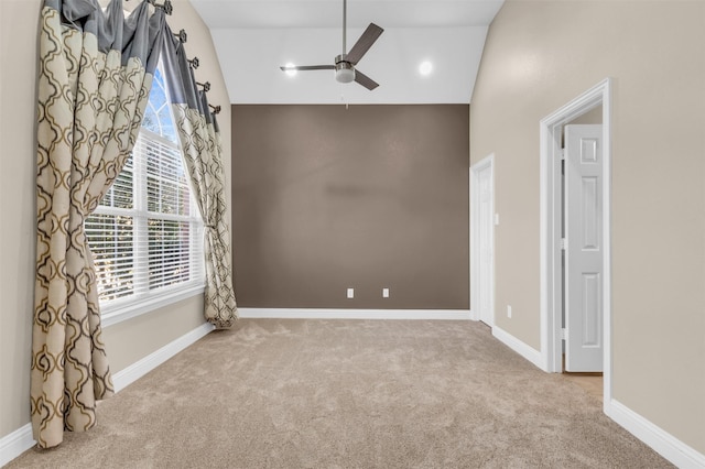 carpeted spare room with recessed lighting, a ceiling fan, baseboards, and high vaulted ceiling