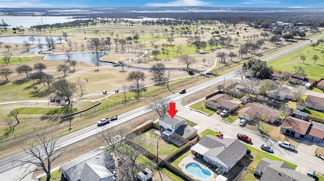 birds eye view of property featuring a residential view and a water view