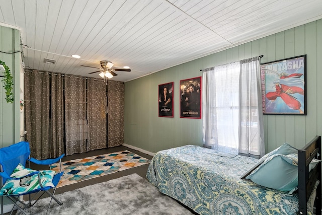 bedroom featuring wood ceiling, visible vents, and ceiling fan