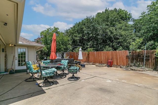 view of patio / terrace featuring outdoor dining area and fence