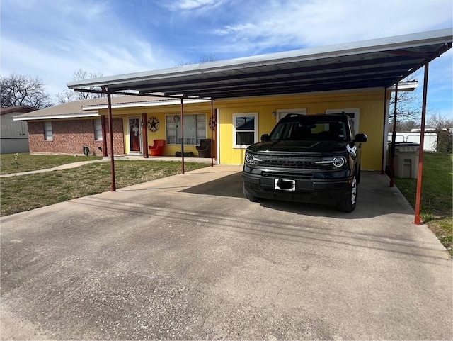 view of parking with a carport and concrete driveway