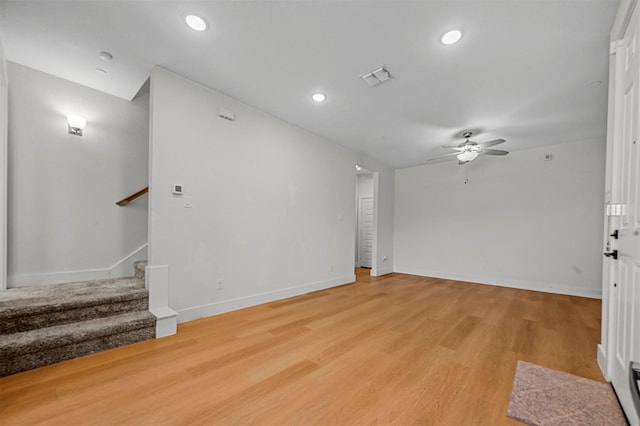 unfurnished living room with visible vents, recessed lighting, ceiling fan, stairs, and light wood-type flooring