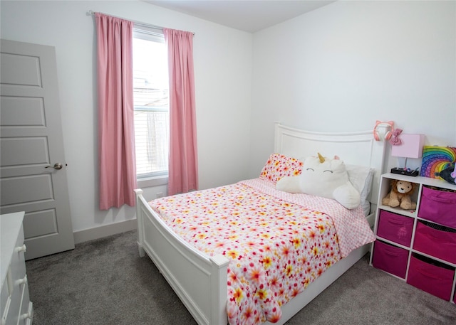 bedroom featuring baseboards and carpet floors