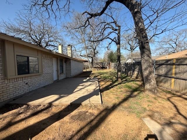 view of yard featuring a fenced backyard and a patio area