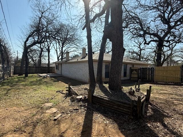 exterior space featuring a fenced backyard