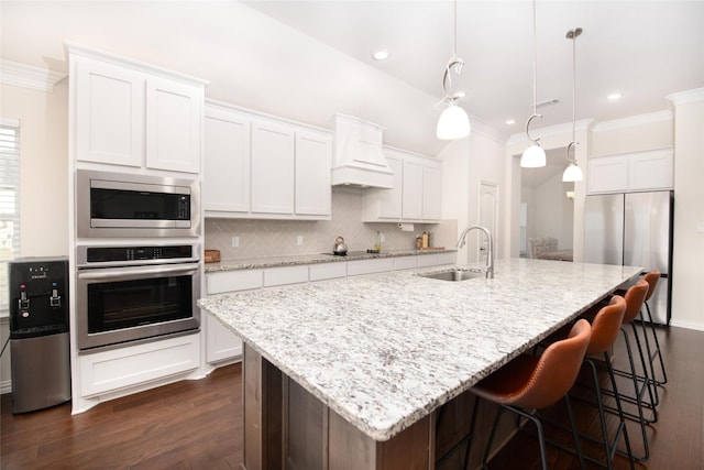 7409 Autumn Grove Ln, Ponder, TX 76259 - kitchen featuring stainless steel appliances, a sink, ornamental molding, dark wood-style floors, and custom exhaust hood