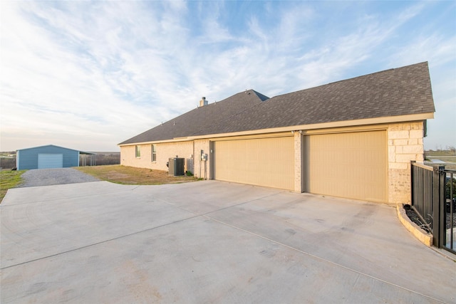 7409 Autumn Grove Ln, Ponder, TX 76259 - view of front of house with central air condition unit, driveway, and roof with shingles