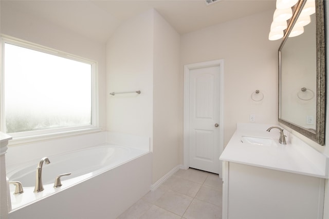 7409 Autumn Grove Ln, Ponder, TX 76259 - bathroom featuring tile patterned flooring, a garden tub, vanity, and baseboards