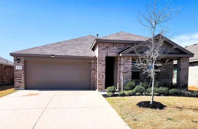 view of front of house with a front lawn, brick siding, concrete driveway, and an attached garage