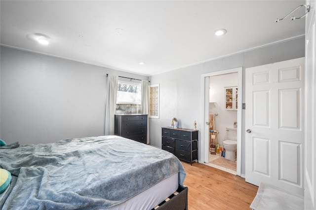 bedroom featuring light wood finished floors