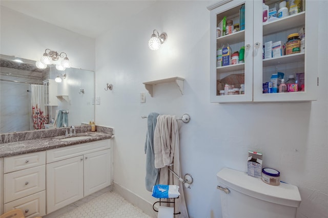 bathroom featuring tile patterned flooring, curtained shower, toilet, and vanity