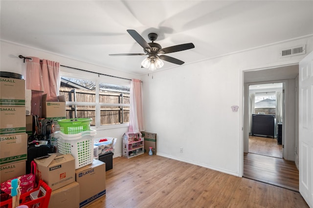 storage area featuring visible vents and ceiling fan