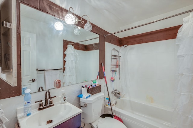 bathroom with toilet, vanity, and shower / bath combo