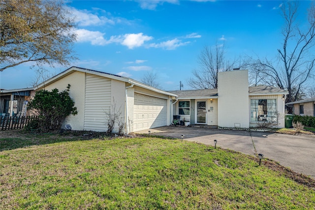 ranch-style home with brick siding, a front lawn, a chimney, a garage, and driveway